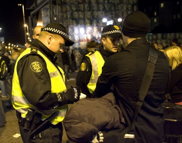 Naked tourist being detained